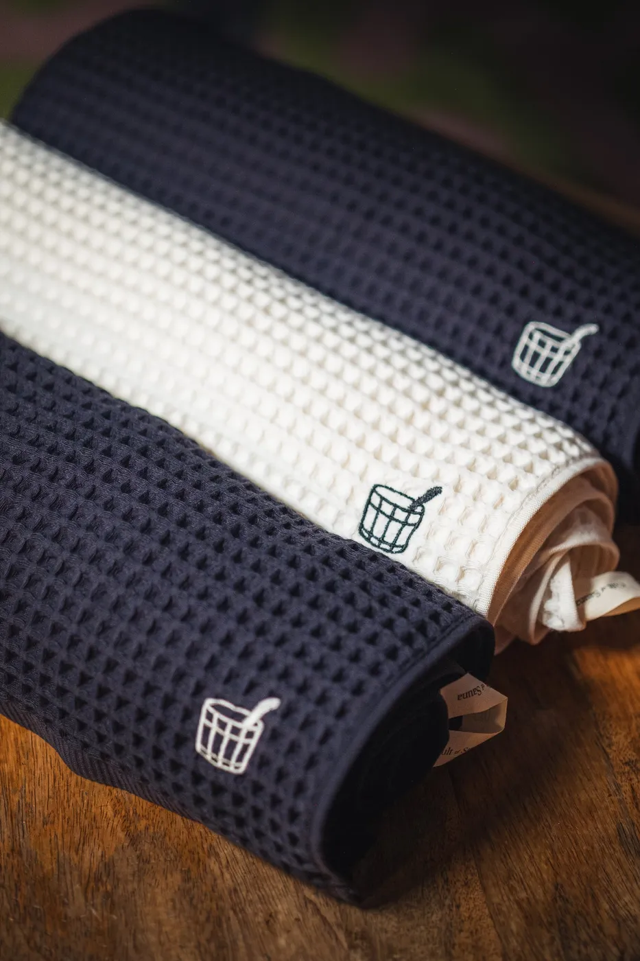 Rolled Sauna Towels in Aurora Black and Arctic Ivory
